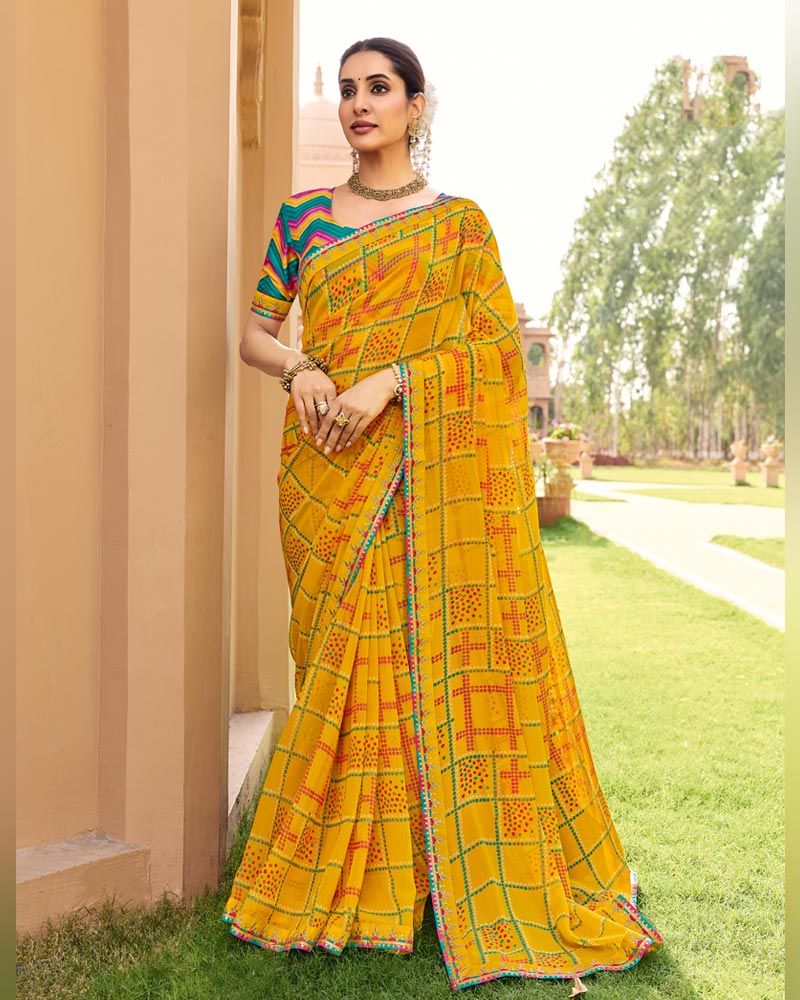 Vishal Prints Kesariya Peela Traditional Print Georgette Saree With Fancy Gota Patti Border