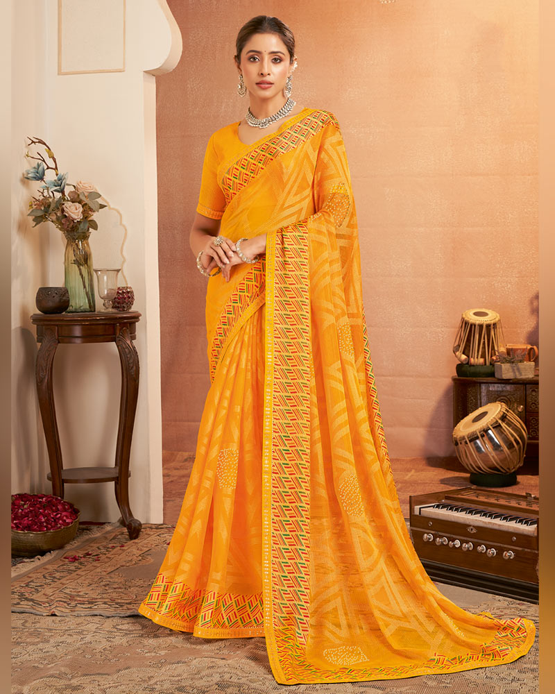 Vishal Prints Yellowish Orange Printed Brasso Saree With Diamond Work And Fancy Border
