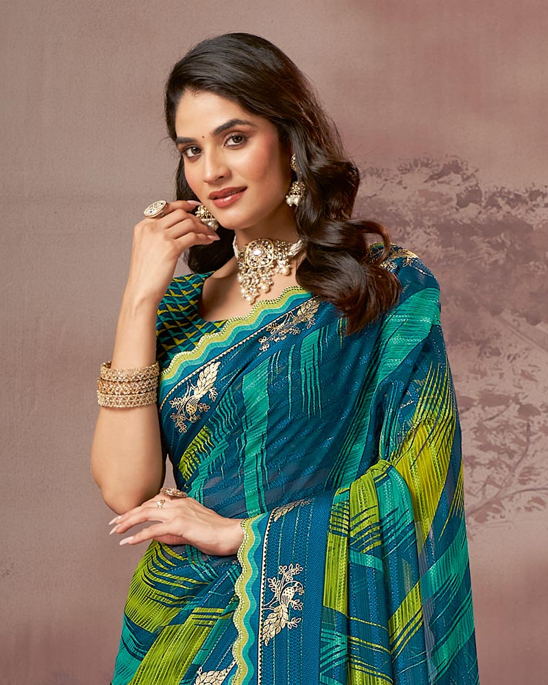 Vishal Prints Deep Teal Blue Printed Fancy Chiffon Saree With Foil Print And Fancy Embroidery Border