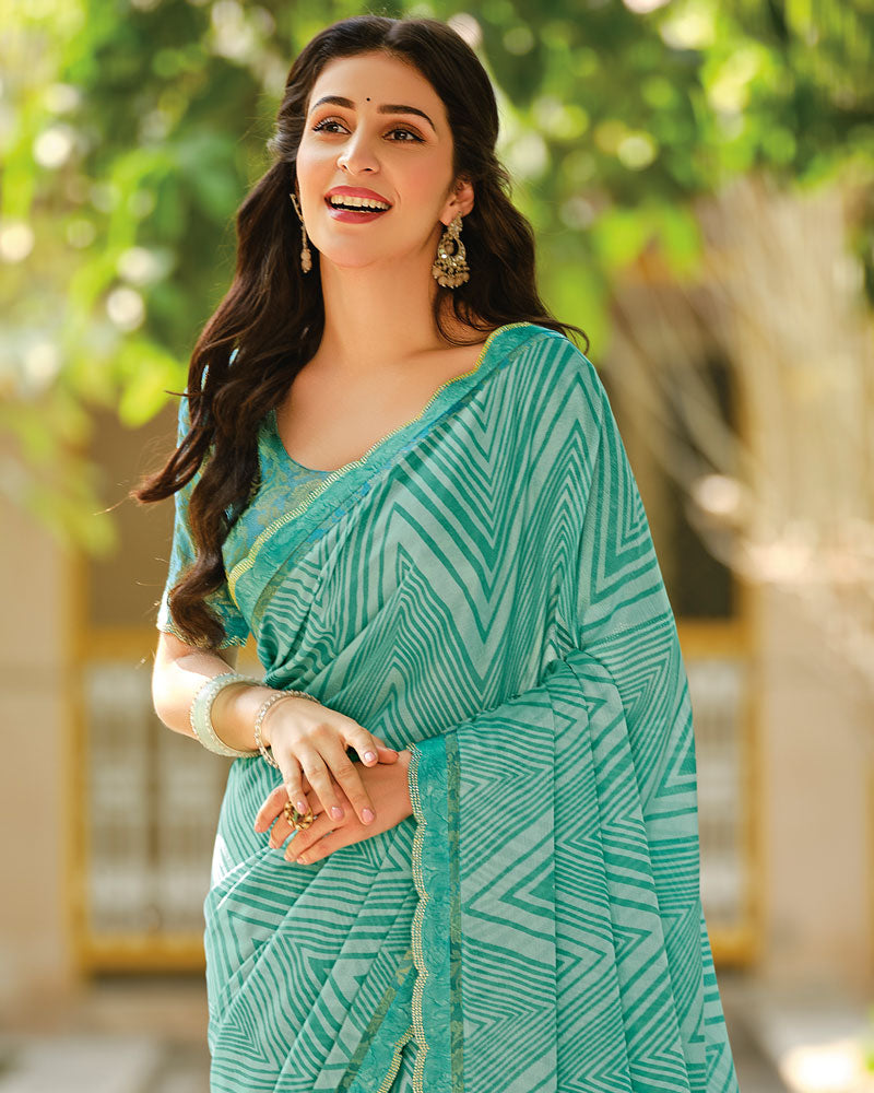 Vishal Prints Pastel Teal Green Printed Brasso Saree With Fancy Cut Work Border