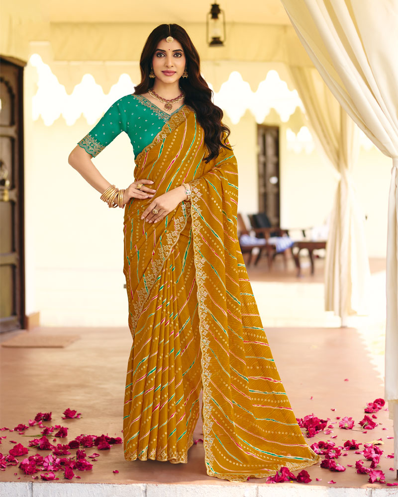 Vishal Prints Deep Mustard Traditional Printed Fancy Chiffon Saree With Foil Print And Cut Work Embroidery Border