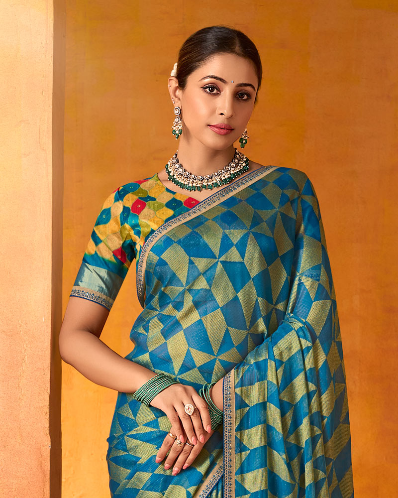 Vishal Prints Ocean Blue And Greenish Beige Printed Chiffon-Brasso Saree With Fancy Border