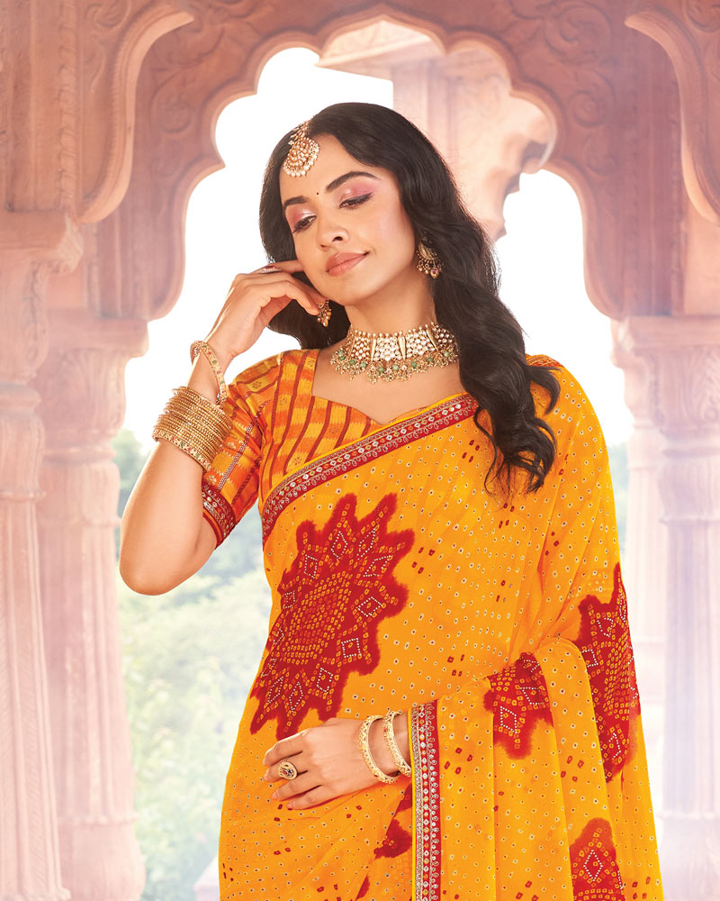Vishal Prints Orangey Yellow Printed Georgette Traditional Print Saree With Diamond Work And Fancy Border