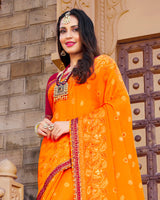 Vishal Prints Orange Brasso Saree With Foil Print And Border