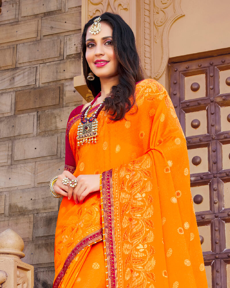Vishal Prints Orange Brasso Saree With Foil Print And Border