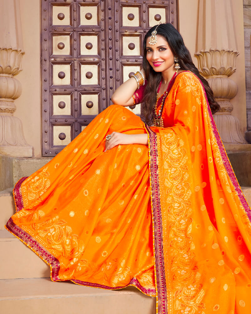 Vishal Prints Orange Brasso Saree With Foil Print And Border
