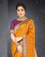 Vishal Prints Saffron Color Brasso Saree With Jari Border And Foil Print