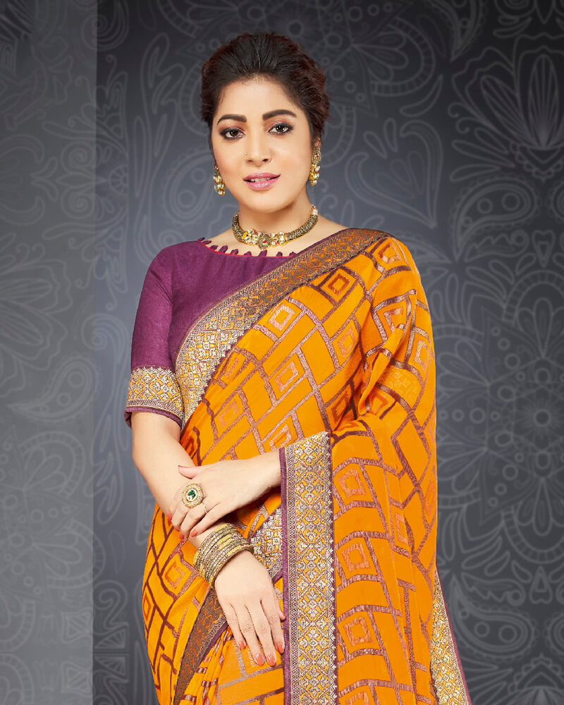 Vishal Prints Saffron Color Brasso Saree With Jari Border And Foil Print