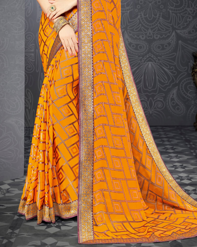 Vishal Prints Saffron Color Brasso Saree With Jari Border And Foil Print