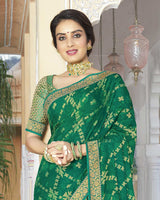 Vishal Prints Dark Sea Green Brasso Saree With Foil Print And Zari Border