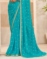 Vishal Prints Dark Turquoise Blue Printed Chiffon Saree With Foil Print And Zari Border