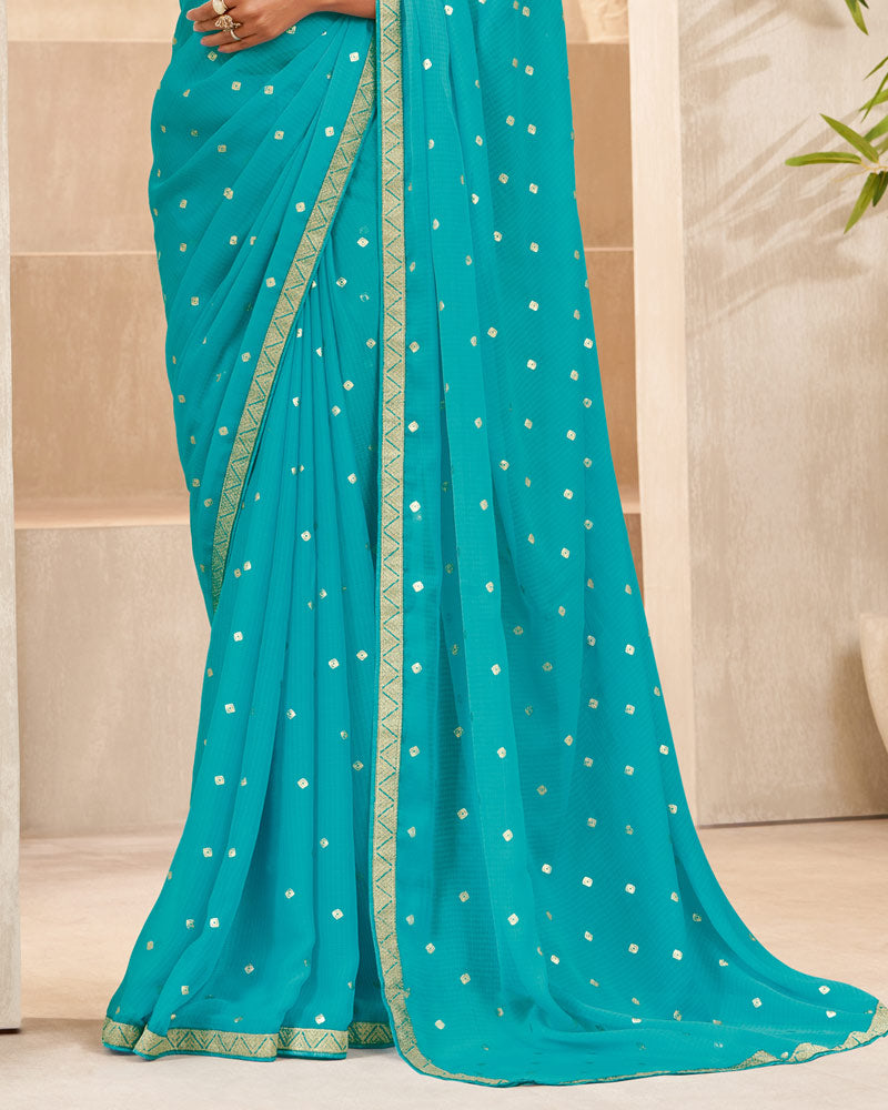 Vishal Prints Dark Turquoise Blue Printed Chiffon Saree With Foil Print And Zari Border