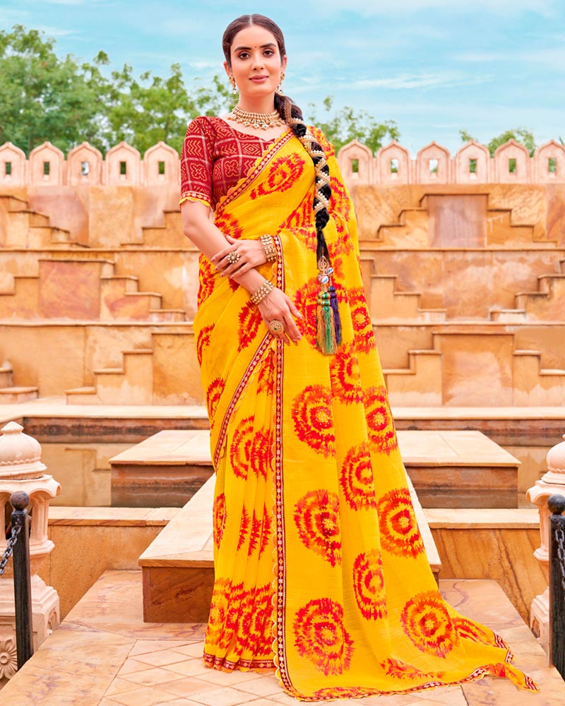 Vishal Prints Dark Yellow And Milano Red Fancy Chiffon Traditional Print Saree With Foil Print And Cut Work Border