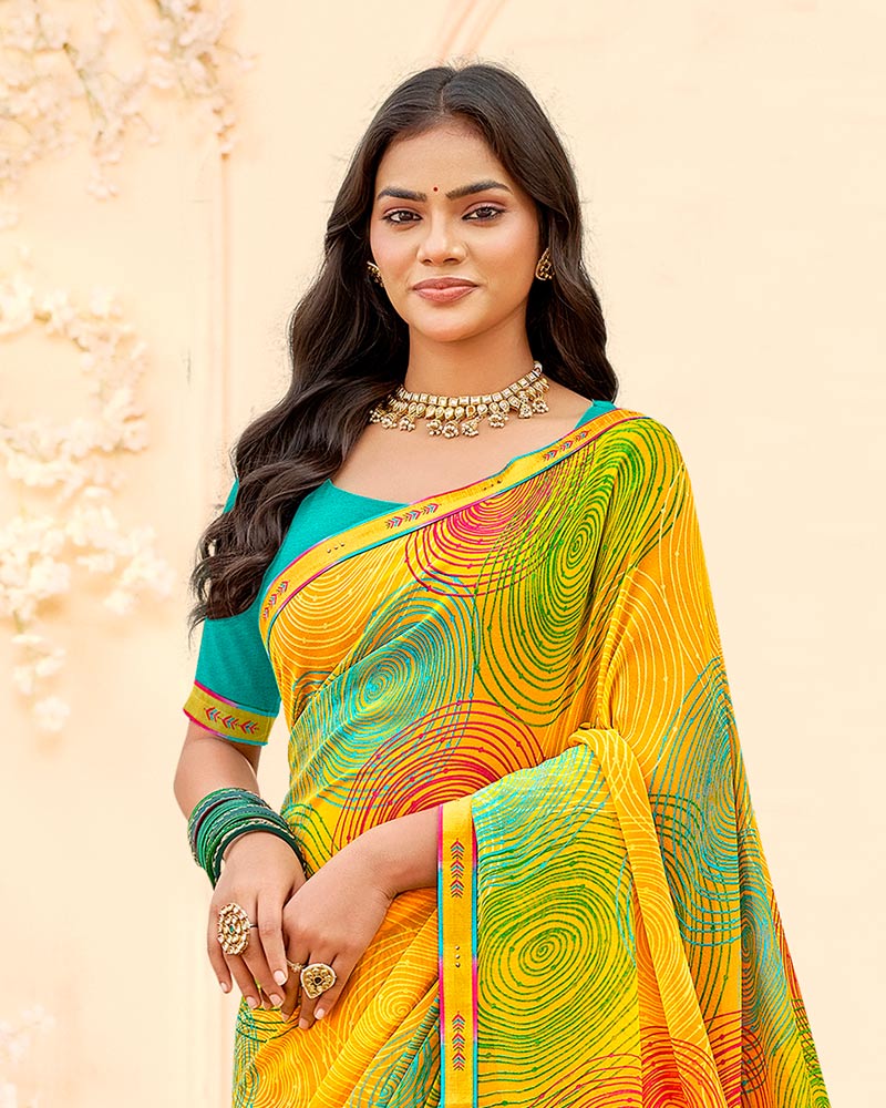 Vishal Prints Orangey Yellow Printed Georgette Saree With Fancy Border
