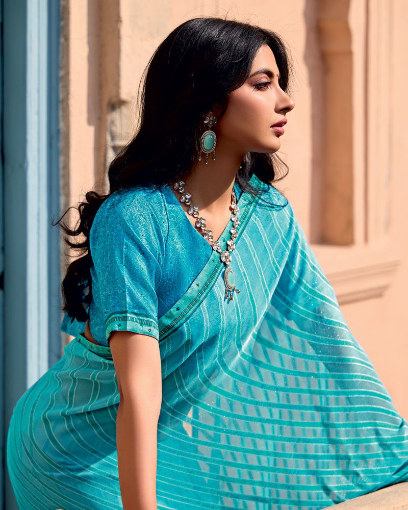 Vishal Prints Fountain Blue Printed Brasso Saree With Fancy Border