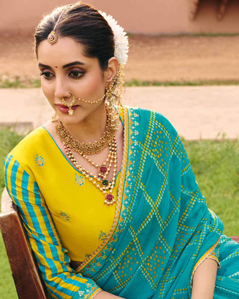 Vishal Prints Neelambari Blue Traditional Print Georgette Saree With Fancy Gota Patti Border