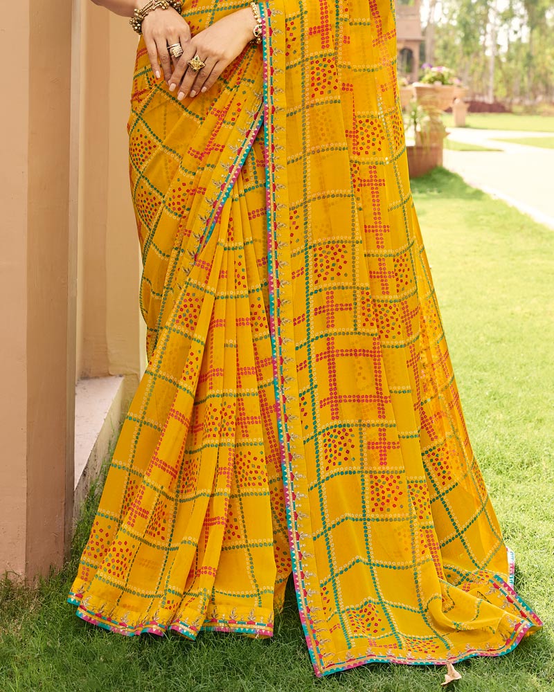 Vishal Prints Kesariya Peela Traditional Print Georgette Saree With Fancy Gota Patti Border