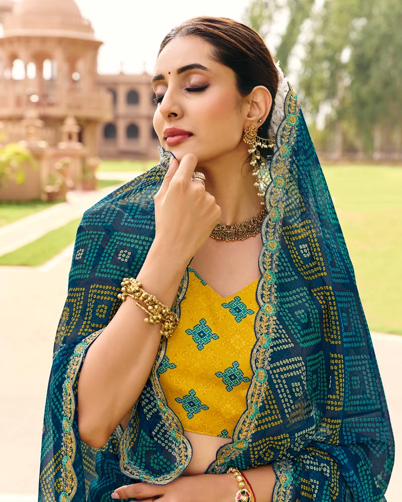 Vishal Prints Peacock Blue Traditional Print Georgette Saree With Fancy Cut Work Embroidery Border