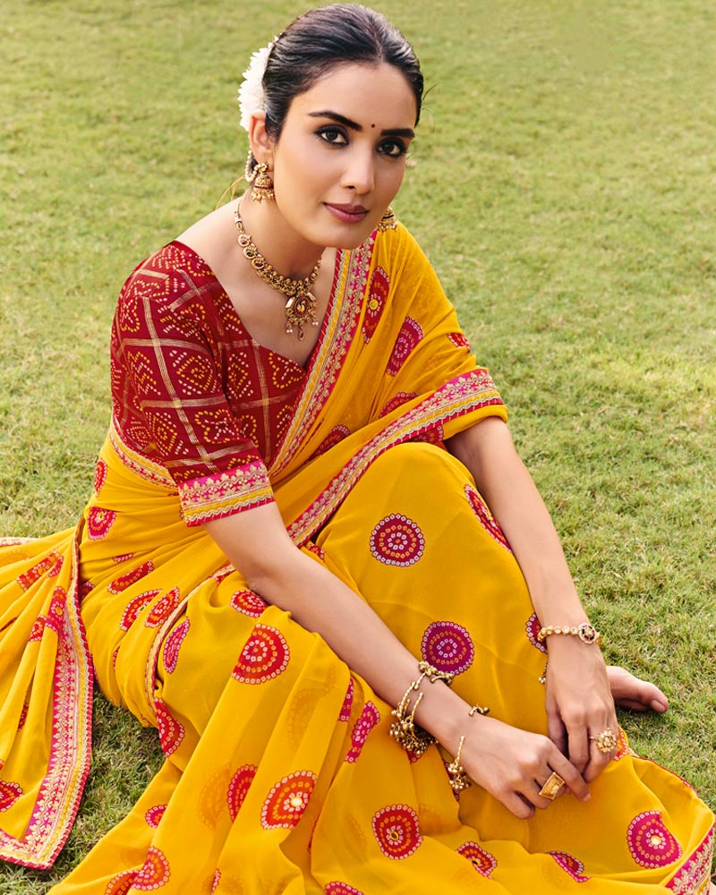 Vishal Prints Haldi Peela Traditional Print Georgette Saree With Fancy Gota Patti Border