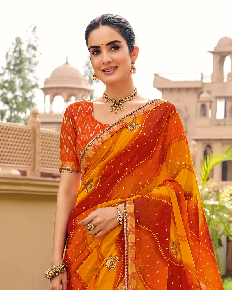 Vishal Prints Saffron Orange Yellow Traditional Print Georgette Saree With Fancy Gota Patti Border
