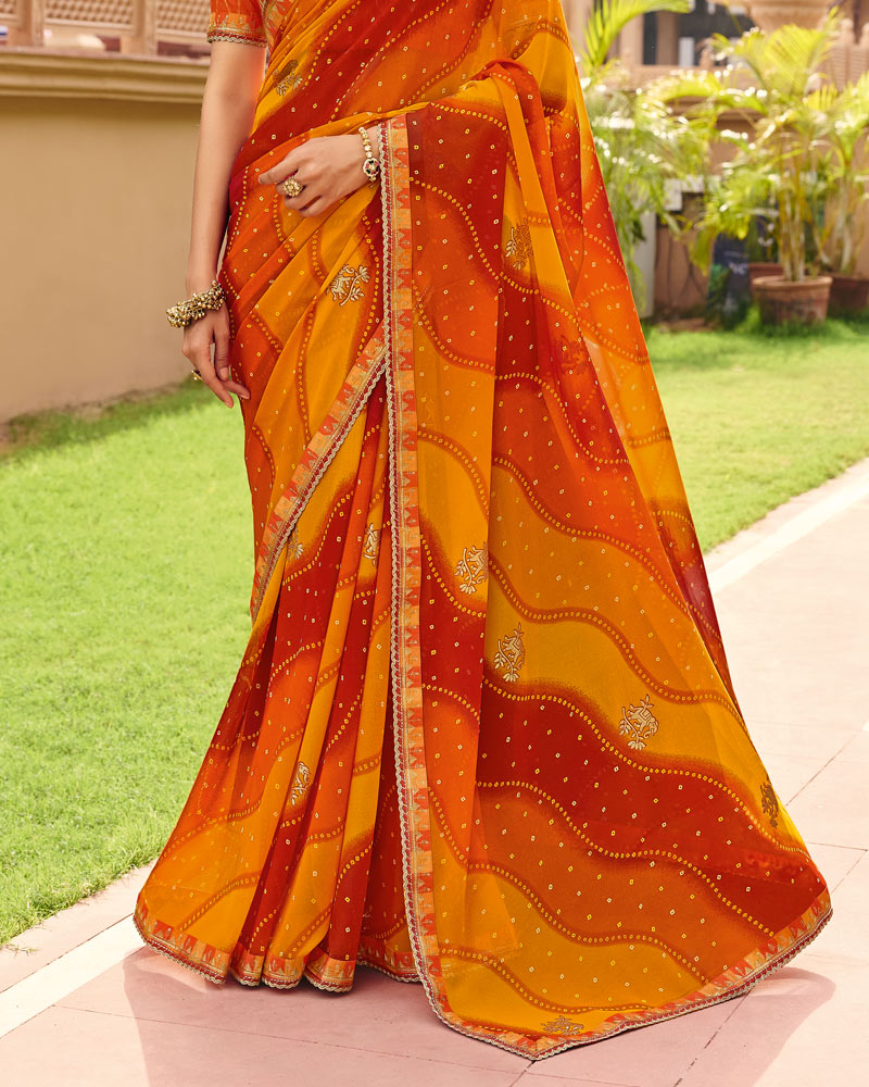 Vishal Prints Saffron Orange Yellow Traditional Print Georgette Saree With Fancy Gota Patti Border