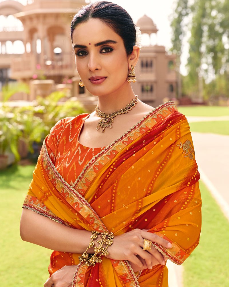 Vishal Prints Saffron Orange Yellow Traditional Print Georgette Saree With Fancy Gota Patti Border