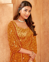 Vishal Prints Rusty Orange Printed Georgette Saree With Foil Print And Fancy Zari Border