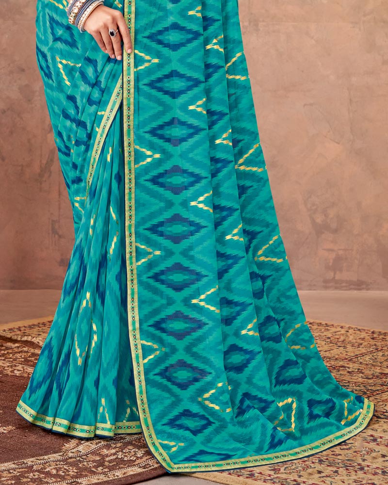 Vishal Prints Teal Blue Printed Georgette Saree With Foil Print And Zari Border