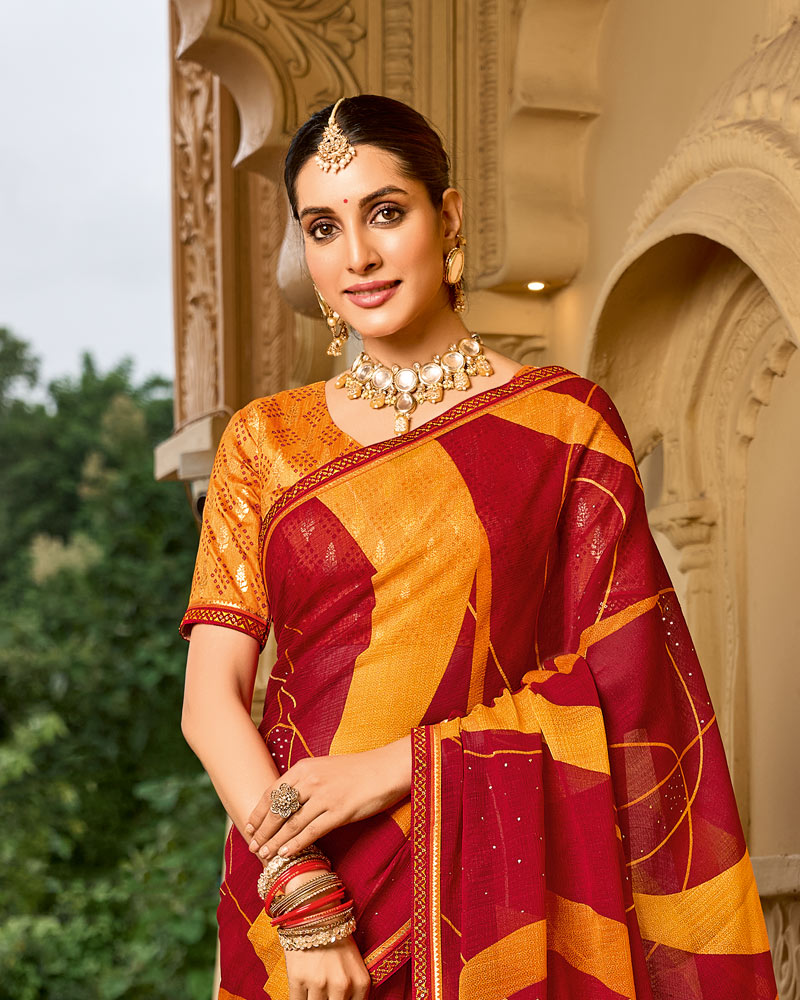 Vishal Prints Brick Red And Carrot Orange Printed Georgette Traditional Print Saree With Embellished Diamond Work And Fancy Border