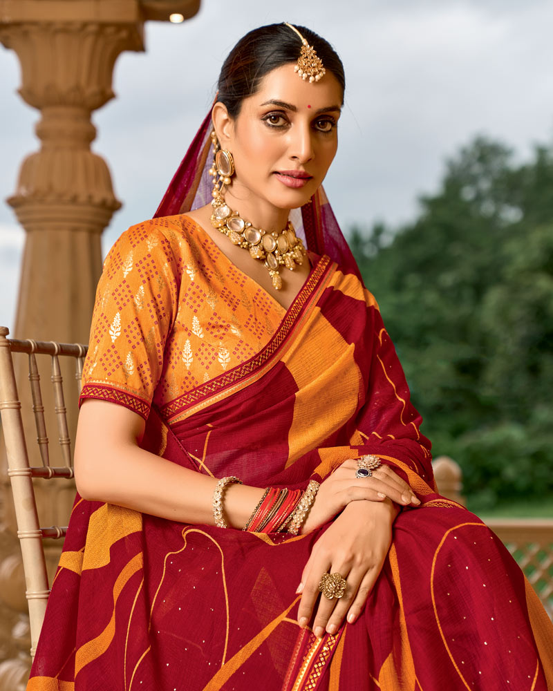 Vishal Prints Brick Red And Carrot Orange Printed Georgette Traditional Print Saree With Embellished Diamond Work And Fancy Border