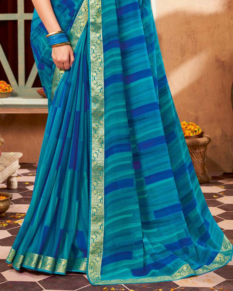 Vishal Prints Teal Blue Printed Georgette Saree With Border