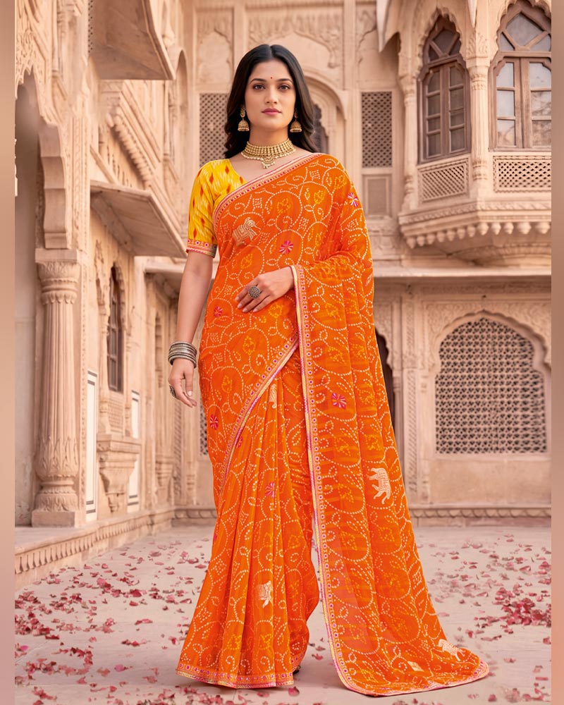 Vishal Prints Bright Orange Patterned Chiffon Traditional Print Saree With Foil Print And Fancy Embroidery Border