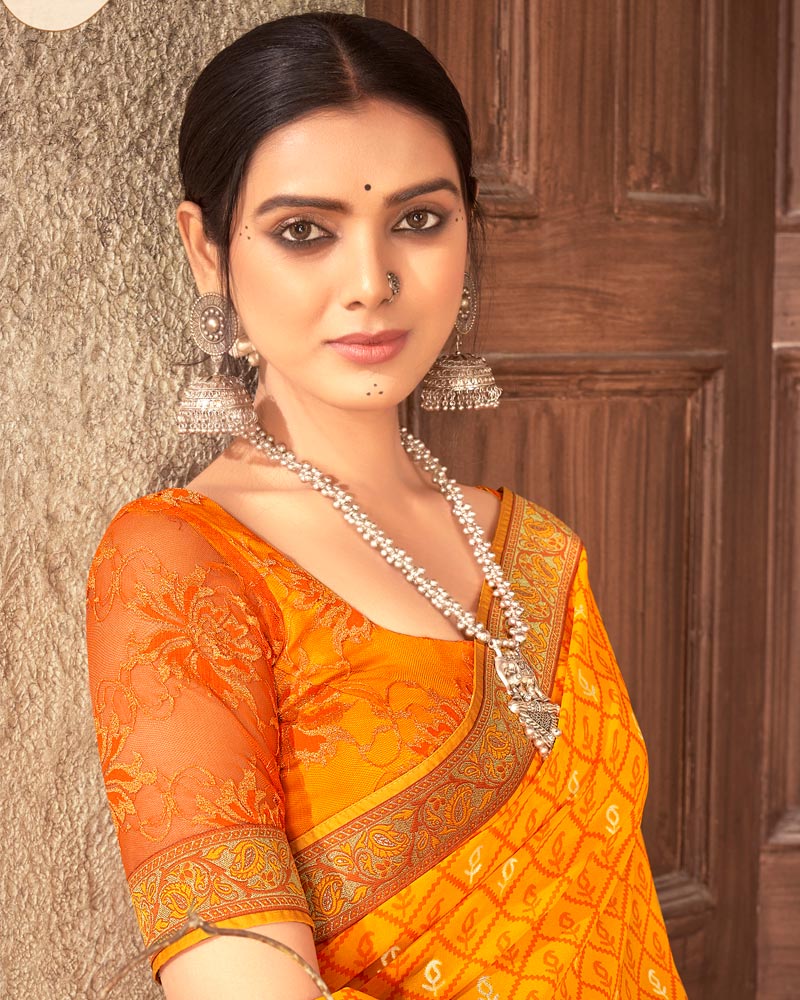 Vishal Prints Yellowish Orange Georgette Saree With Foil Print And Zari Border