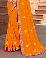 Vishal Prints Bright Orange Georgette Saree With Foil Work And Zari Border