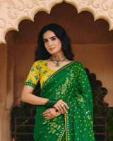 Vishal Prints Pine Green Traditional Print Chiffon Saree With Foil Print And Fancy Embroidered Border