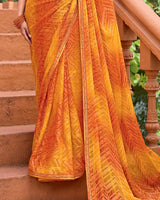 Vishal Prints Saffron Orange Printed Patterned Brasso Bandhani Print Saree With Fancy Border