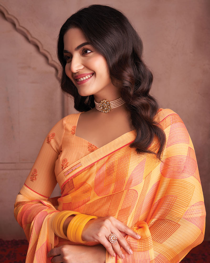 Vishal Prints Pastel Orange Printed Patterned Chiffon Saree With Fancy Border