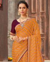 Vishal Prints Dark Orange Brasso Saree With Foil Print And Zari Border