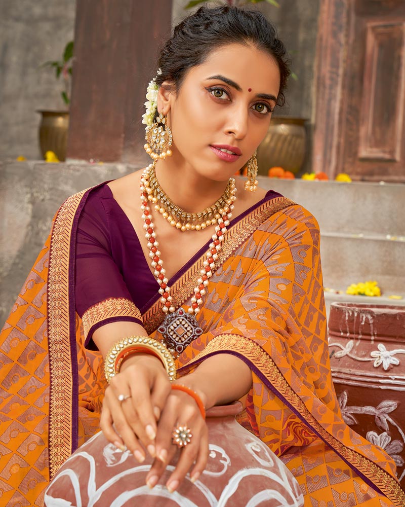 Vishal Prints Dark Orange Brasso Saree With Foil Print And Zari Border