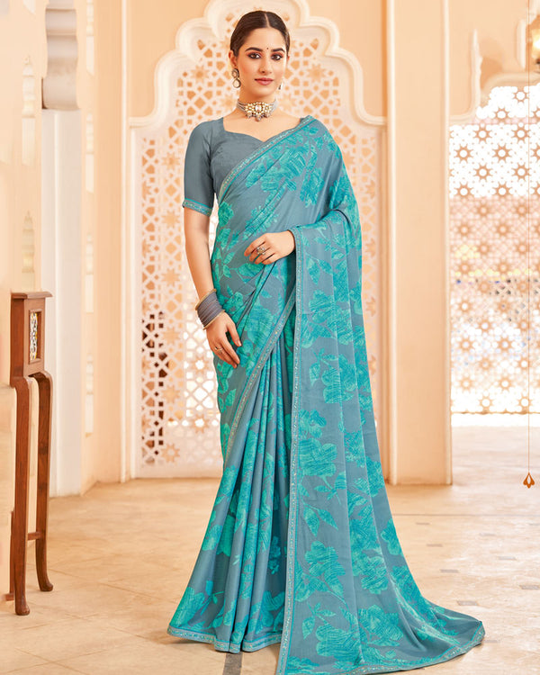 Vishal Prints Dark Pastel Blue Printed Brasso Saree With Fancy Border