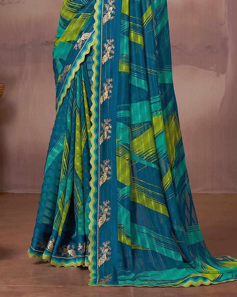 Vishal Prints Deep Teal Blue Printed Fancy Chiffon Saree With Foil Print And Fancy Embroidery Border