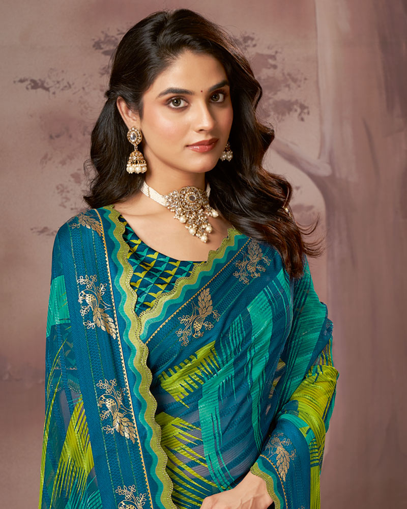Vishal Prints Deep Teal Blue Printed Fancy Chiffon Saree With Foil Print And Fancy Embroidery Border