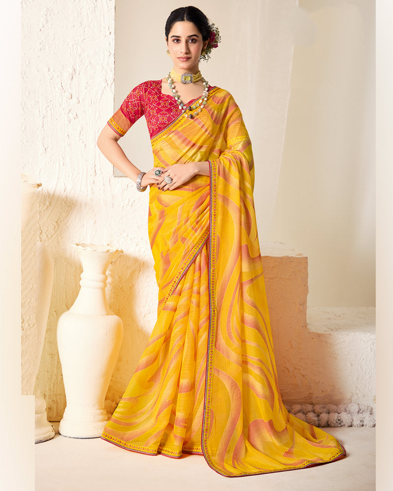 Vishal Prints Orangey Yellow Printed Chiffon-Brasso Saree With Fancy Border