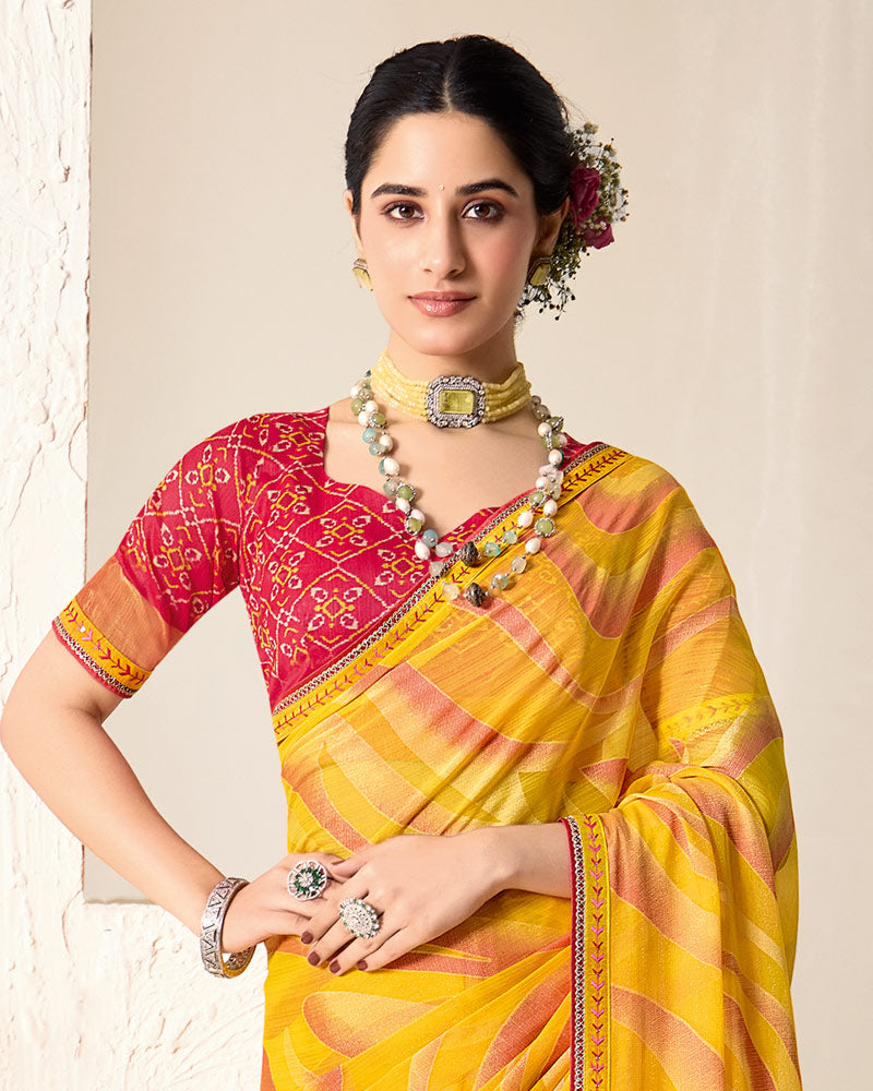Vishal Prints Orangey Yellow Printed Chiffon-Brasso Saree With Fancy Border