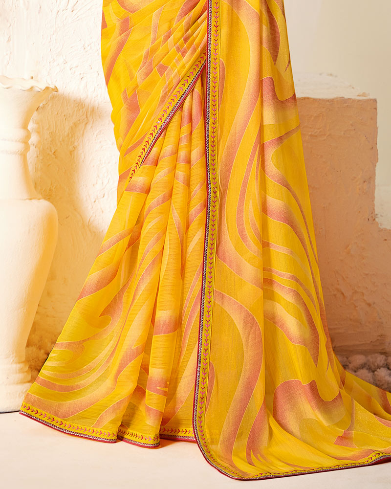 Vishal Prints Orangey Yellow Printed Chiffon-Brasso Saree With Fancy Border