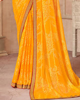 Vishal Prints Yellowish Orange Patterned Brasso Saree With Zari Border