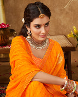 Vishal Prints Saffron Color Printed Georgette Bandhani Print Saree With Foil Print And Fancy Border