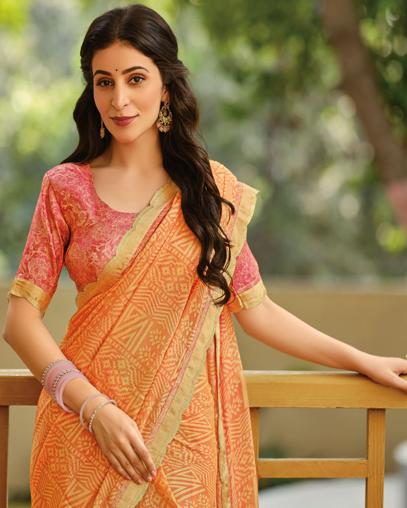 Vishal Prints Dusty Orange Printed Brasso Saree With Fancy Cut Work Border
