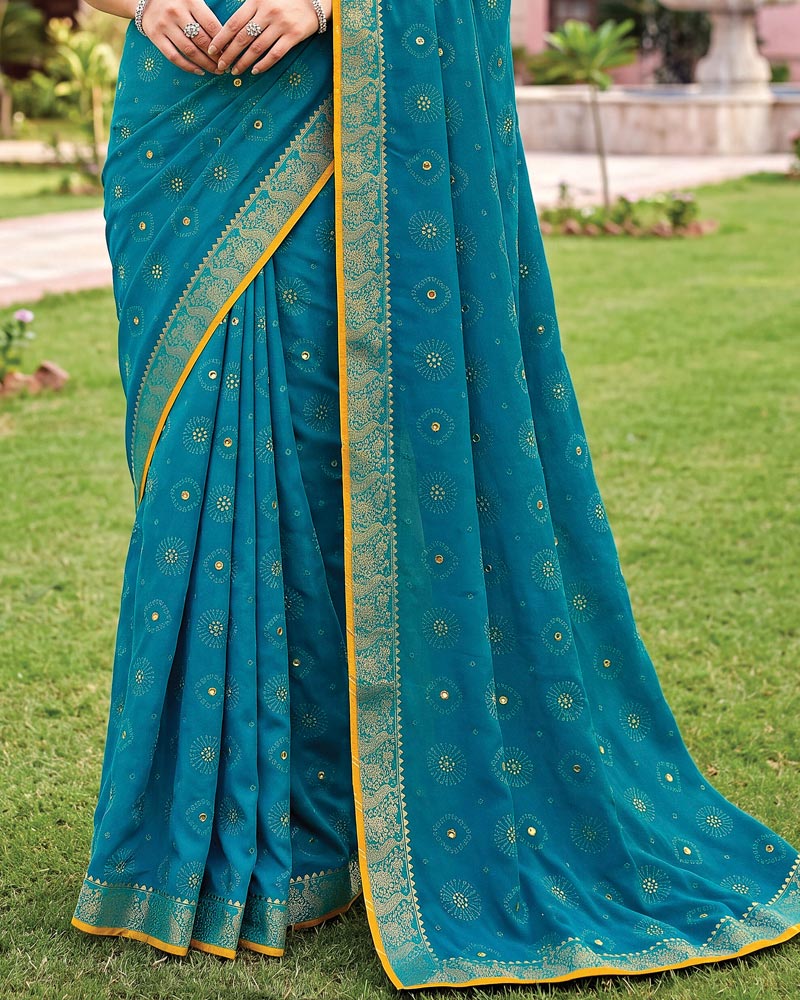 Vishal Prints Deep Aqua Blue Traditional Print Georgette Saree With Mirror Work And Zari Border
