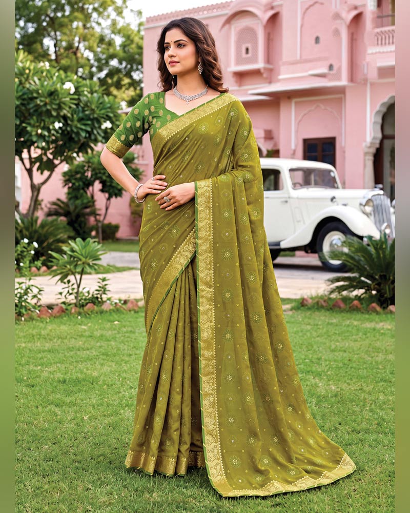 Vishal Prints Dusty Mehandi Green Traditional Print Georgette Saree With Mirror Work And Zari Border